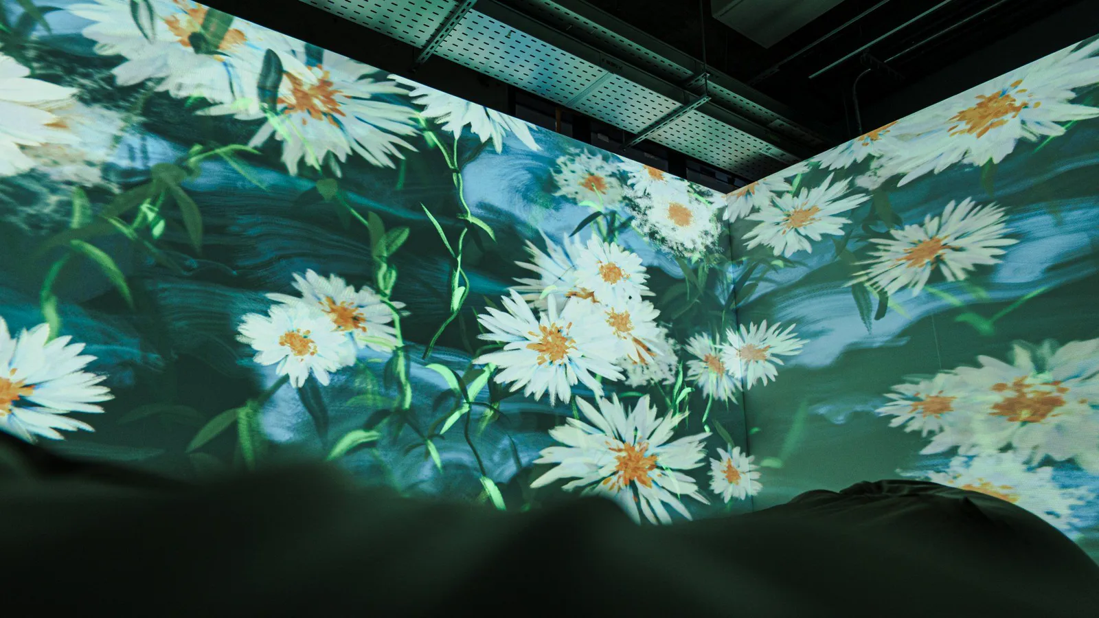 White flowers folding across the corner of two walls